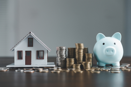 house model, coins, and a piggy bank