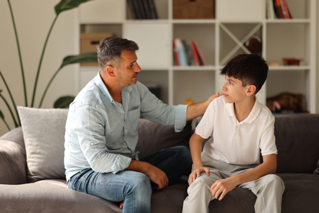 father talking to teenaged son