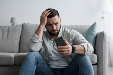 Husband dropping wedding ring into wife's hand