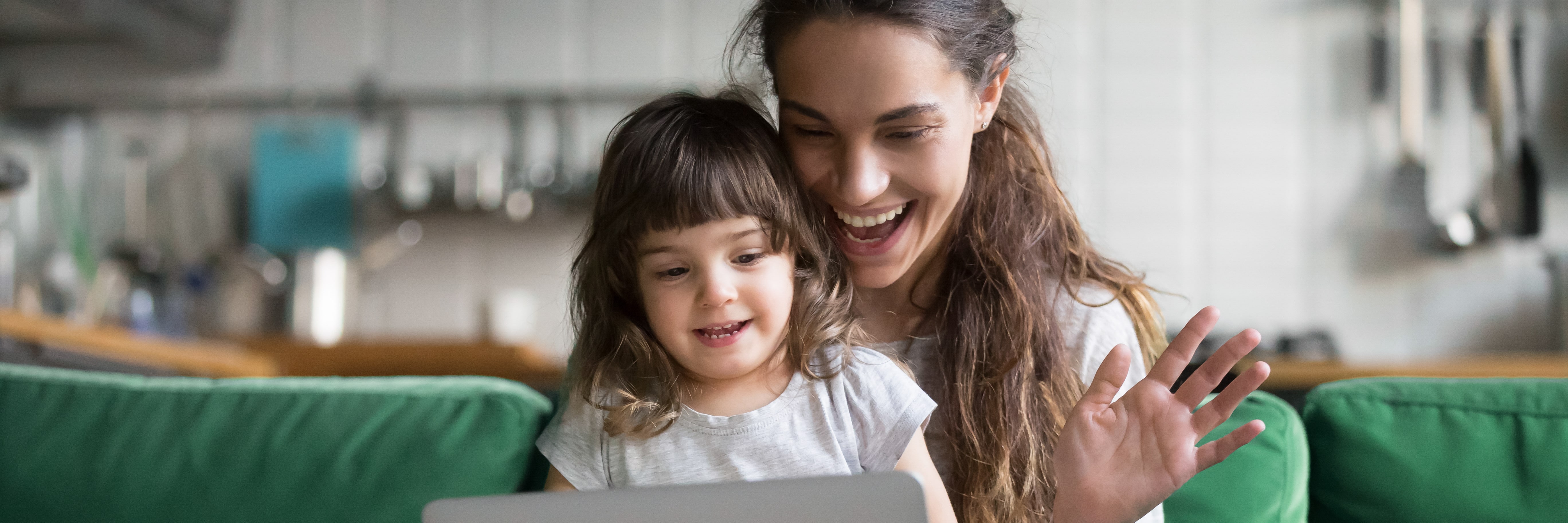 A women and her young daughter zoom calling someone